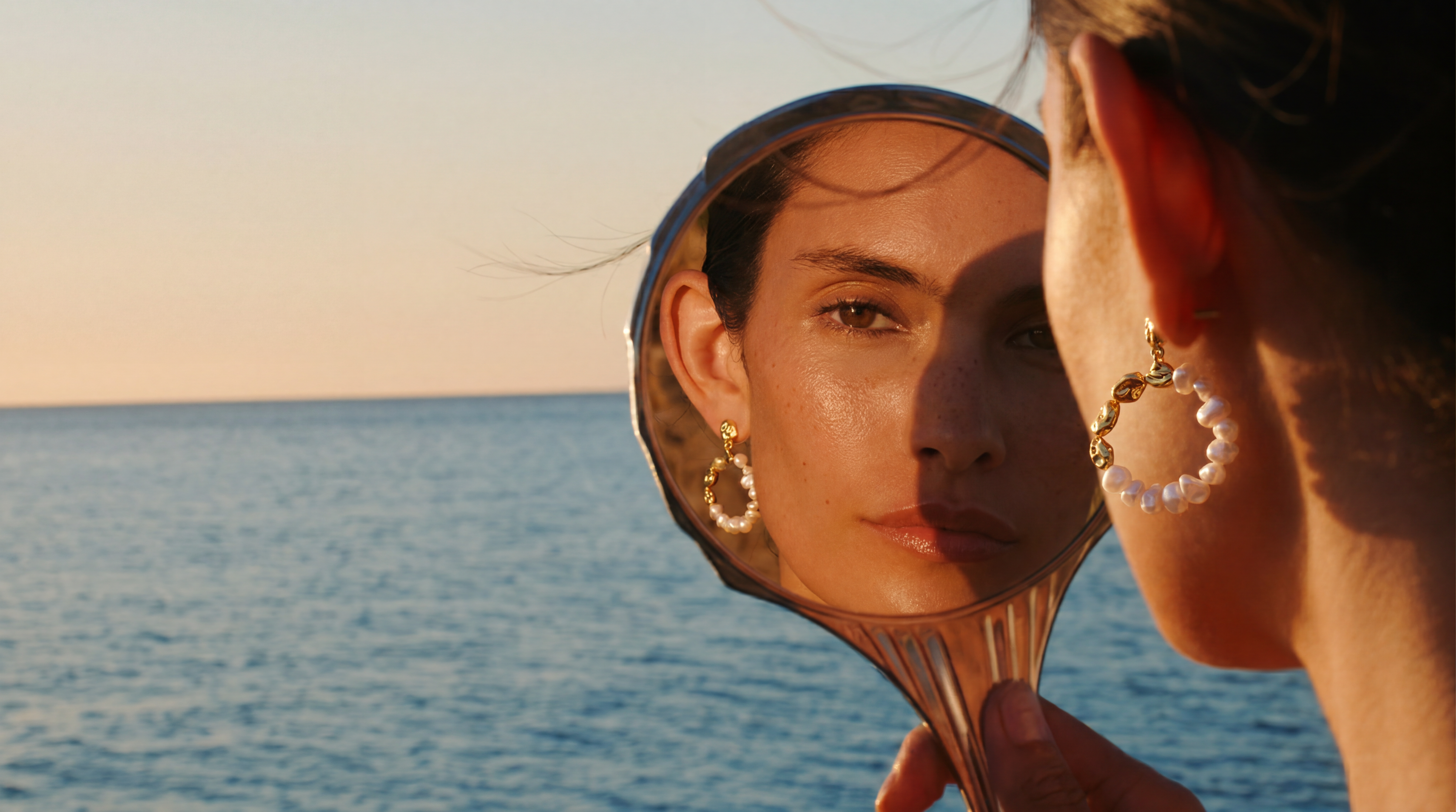 The lady wearing pearl earrings